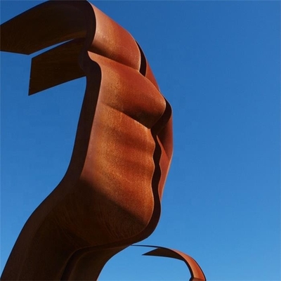 Ligne ruban en acier de Heek de visages de la sculpture deux en Corten imaginaire